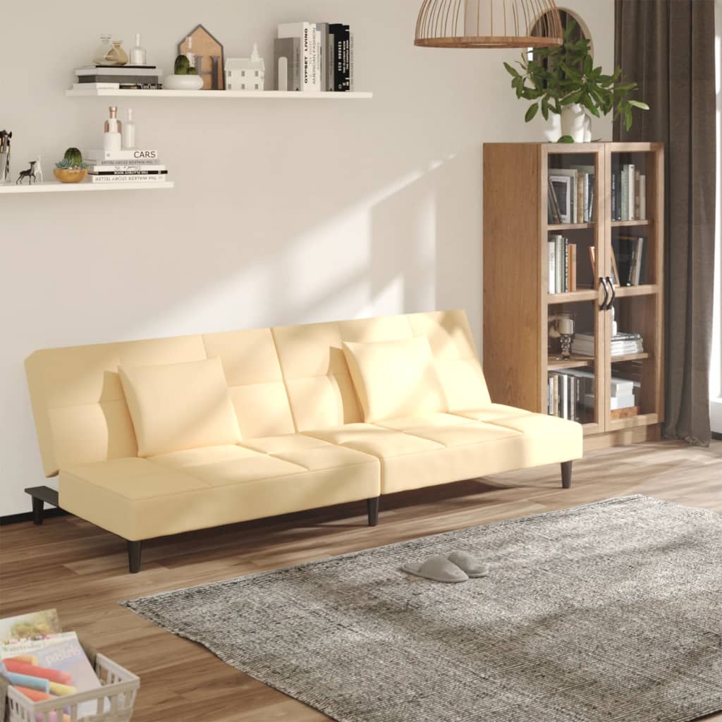 vidaXL Dvivietė sofa-lova su dvejomis pagalvėmis, kreminė, aksomas